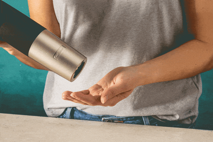 Gif of electric wine opener releasing natural cork.